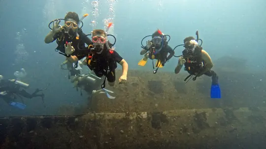 Divers hovering above a wreck, illustrating Peak Performance Buoyancy skills in Hurghada