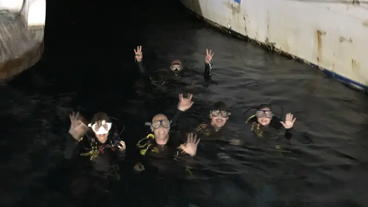 Divers together at the surface after dark in Hurghada