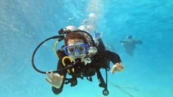 Diver wearing a blue mask while scuba diving in Hurghada