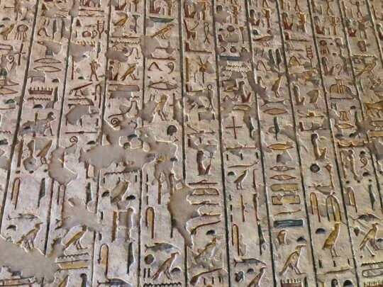 Painted hieroglyphs on a tomb wall in Luxor