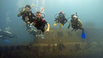 Divers hovering above a wreck, illustrating Peak Performance Buoyancy skills in Hurghada