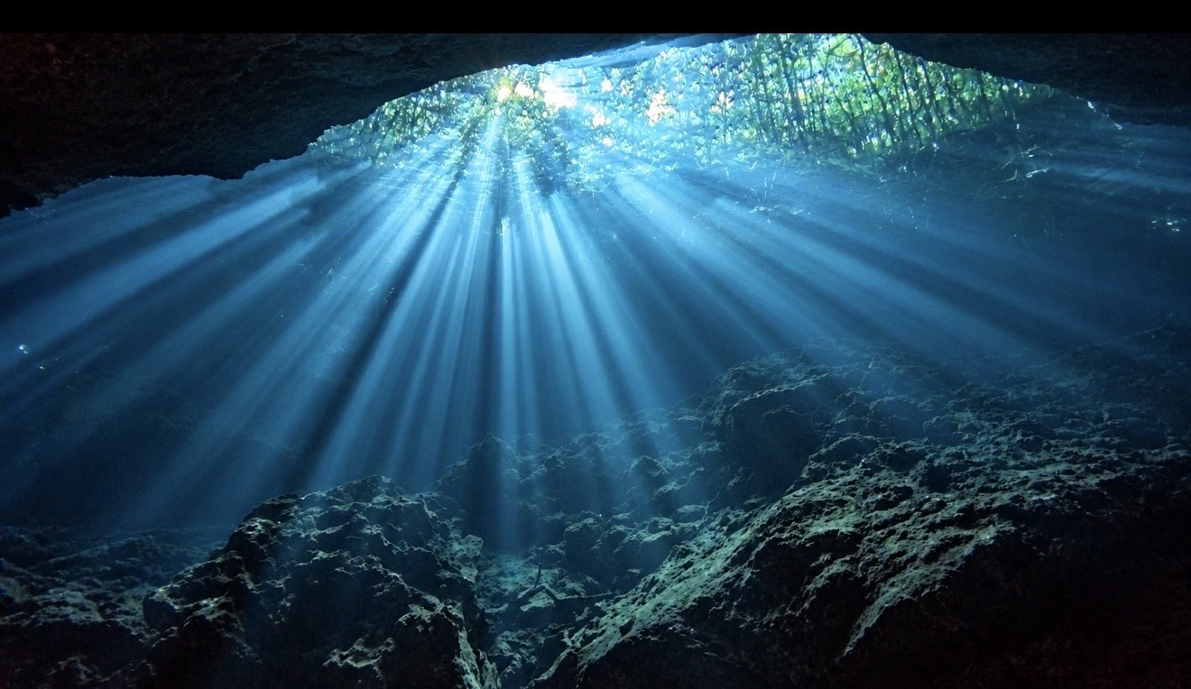 Sunlight streaming into an underwater cavern